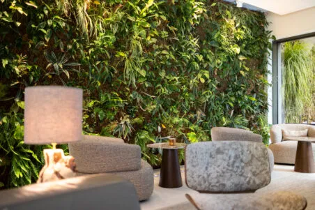 View of the hotel lobby with comfortable sofas and cozy lounge areas, creating a warm and elegant atmosphere.