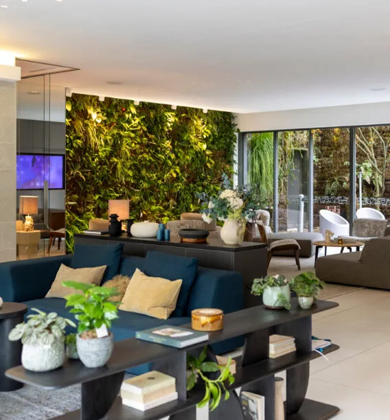 Wide view of the hotel lobby and lounges, seen from the reception area, with welcoming spaces and elegant decor.